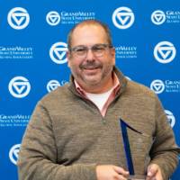 Dr. Stabler holding award